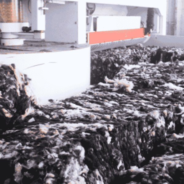 Pile of black and white fabric in a textile factory.