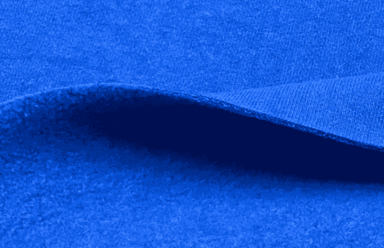 Bright blue fleece knit fabric, soft and cozy texture.